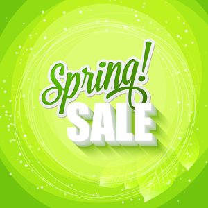 Green text art of Spring Sale on a leafy green background